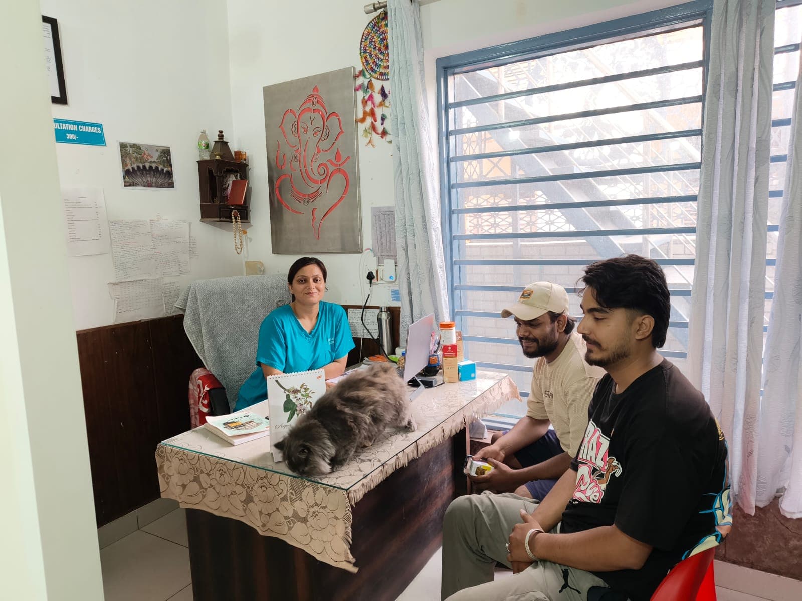 Dr. Anjali Negi in consultation with pet parents and their cat