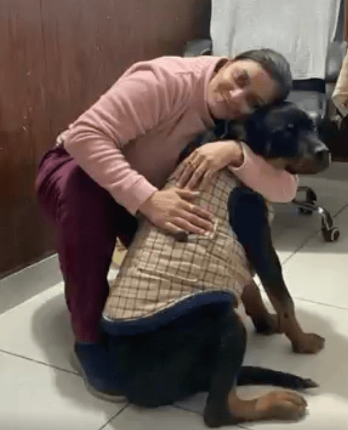 Dr. Anjali Negi with a golden retriever
